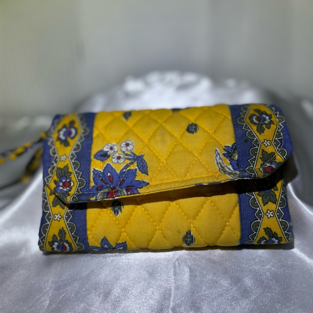 Not a Vera Bradley. Wallet sure looks like one. Gold & blue lots of stor…